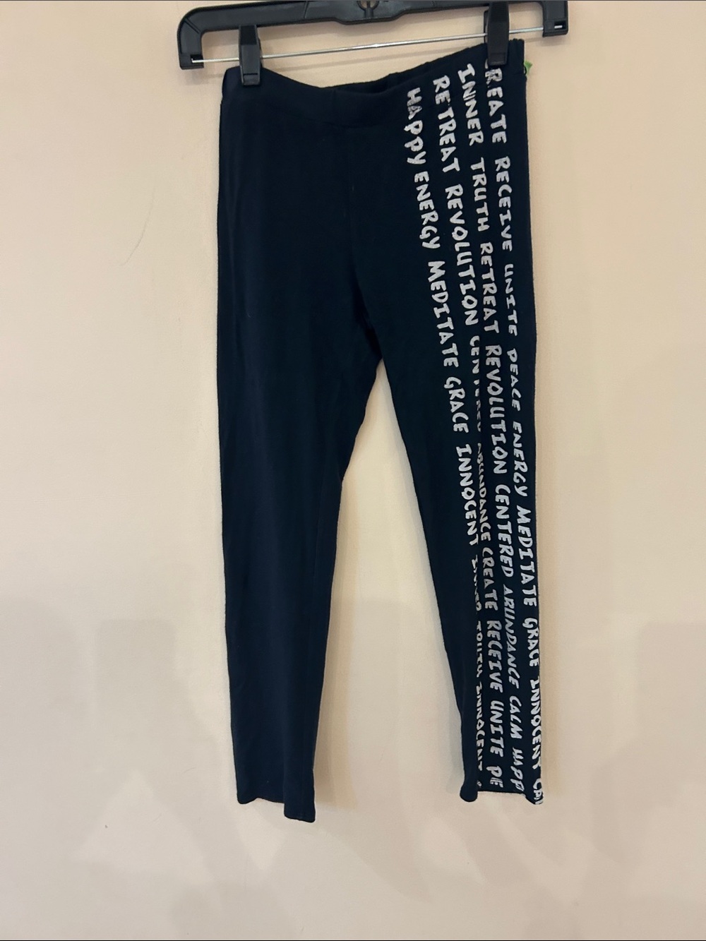 Leggings with inspirational printing on legs.